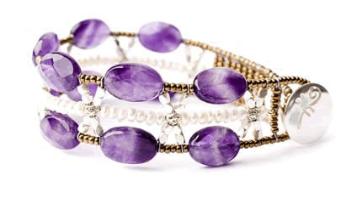 Italian amethyst and pearl bracelet by Ziio has a sterling silver button clasp.